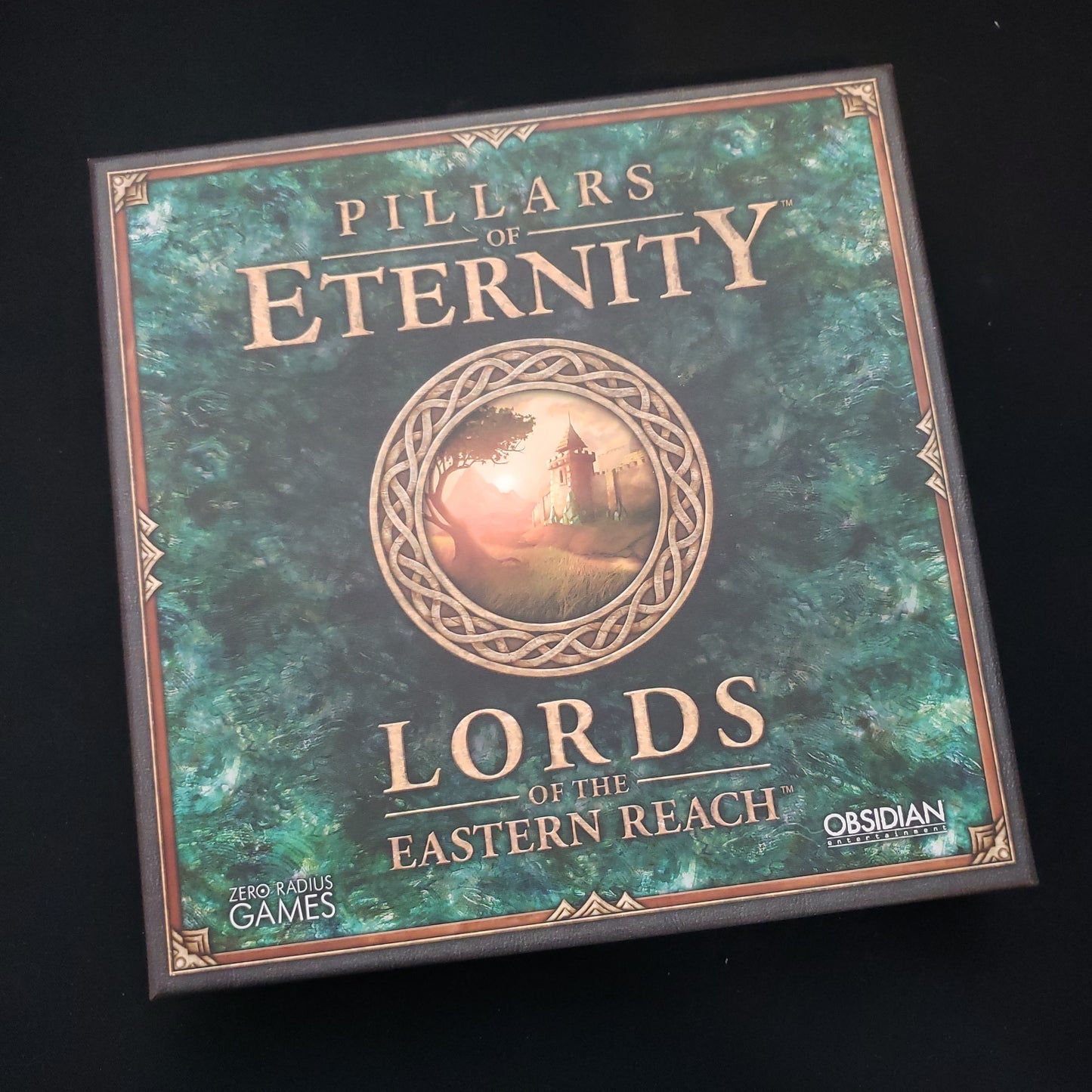 Image shows the front cover of the box of the Pillars of Eternity: Lords of the Eastern Reach card game