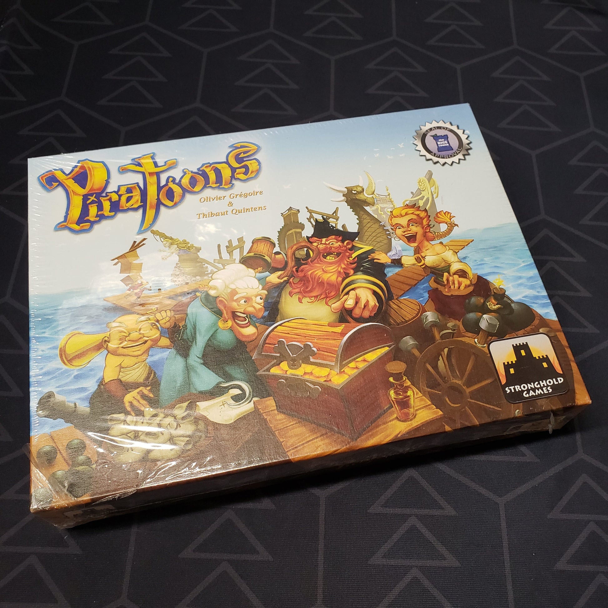 Image shows the front cover of the box for the Piratoons board game