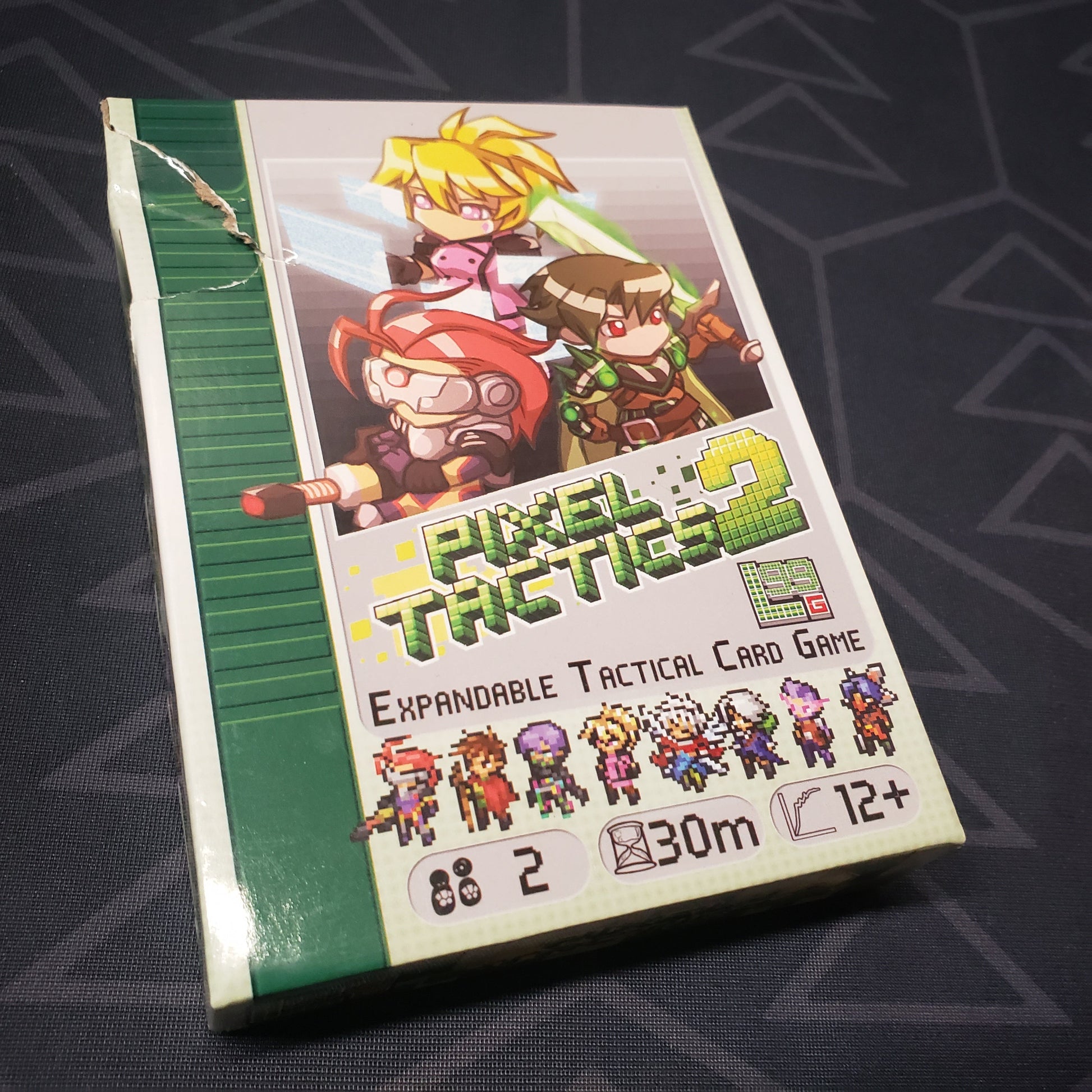 Image shows the front cover of the box for the Pixel Tactics 2 card game