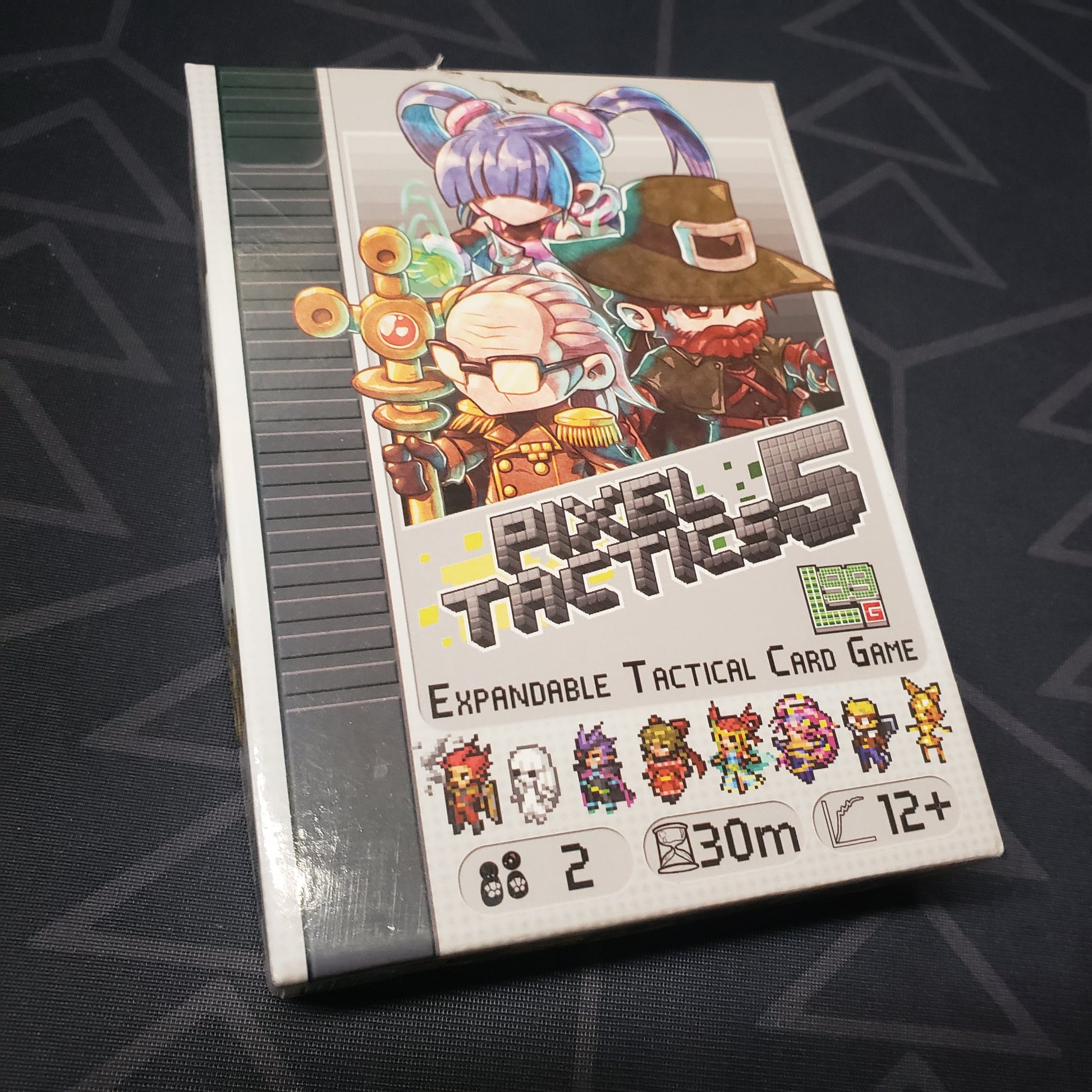 Image shows the front cover of the box for the Pixel Tactics 5 card game
