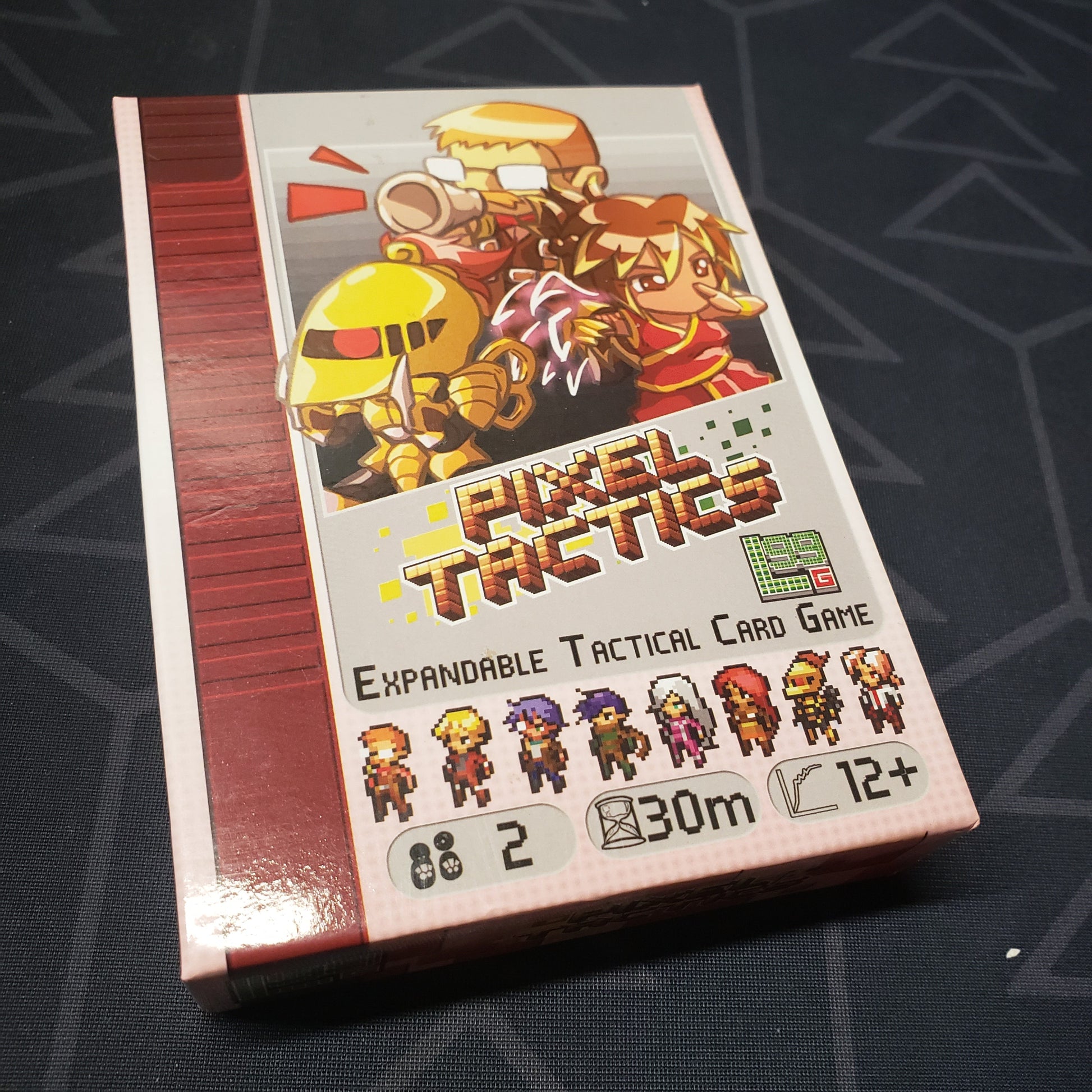 Image shows the front cover of the box for the Pixel Tactics card game