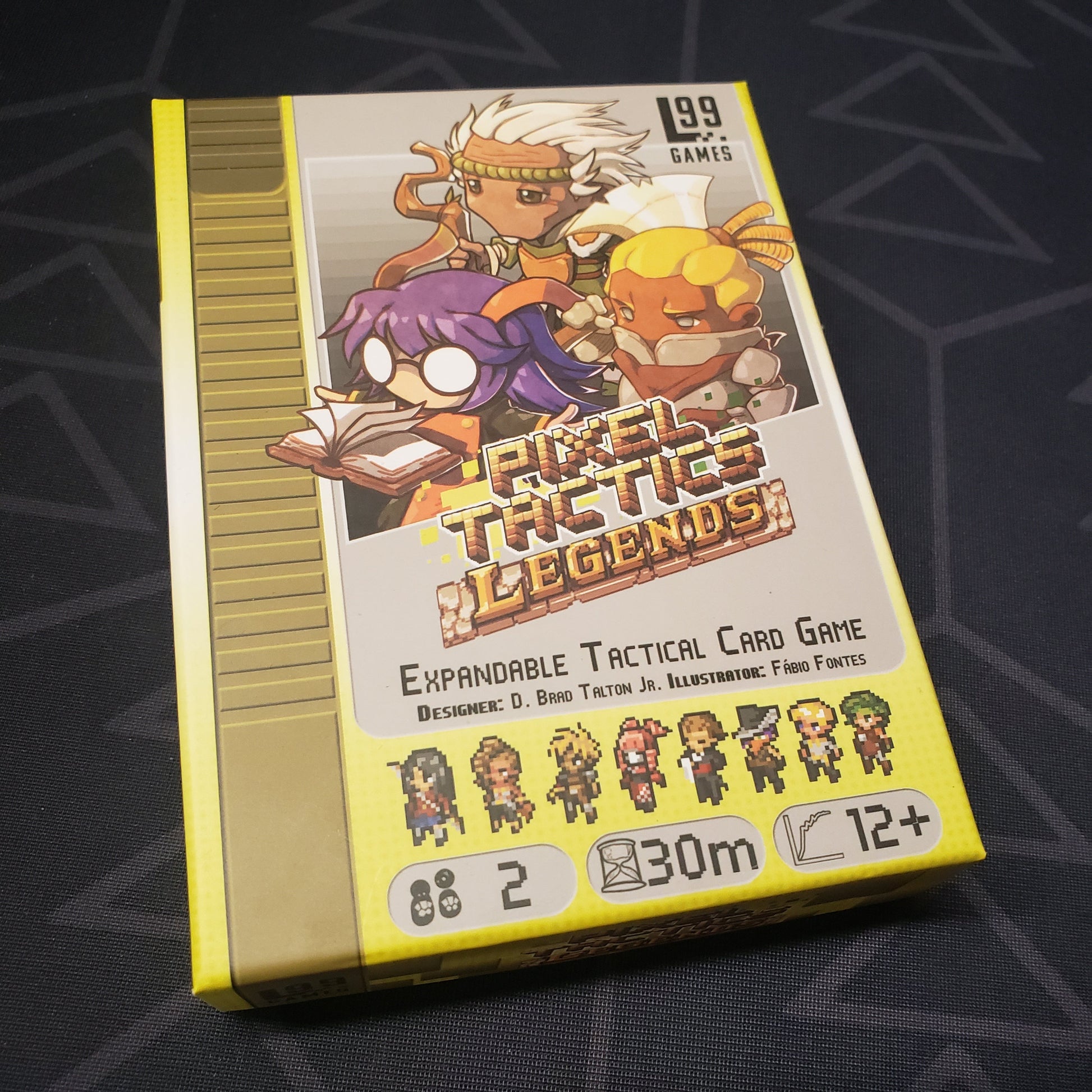 Image shows the front cover of the box for the Pixel Tactics: Legends card game