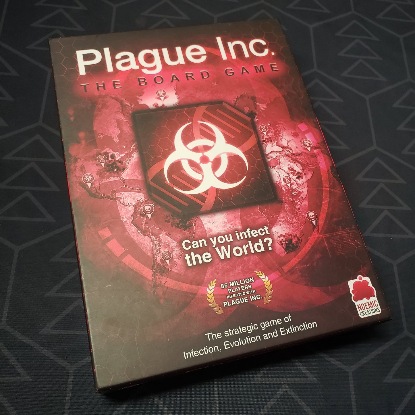 Image shows the front cover of the box for Plague Inc.: The Board Game