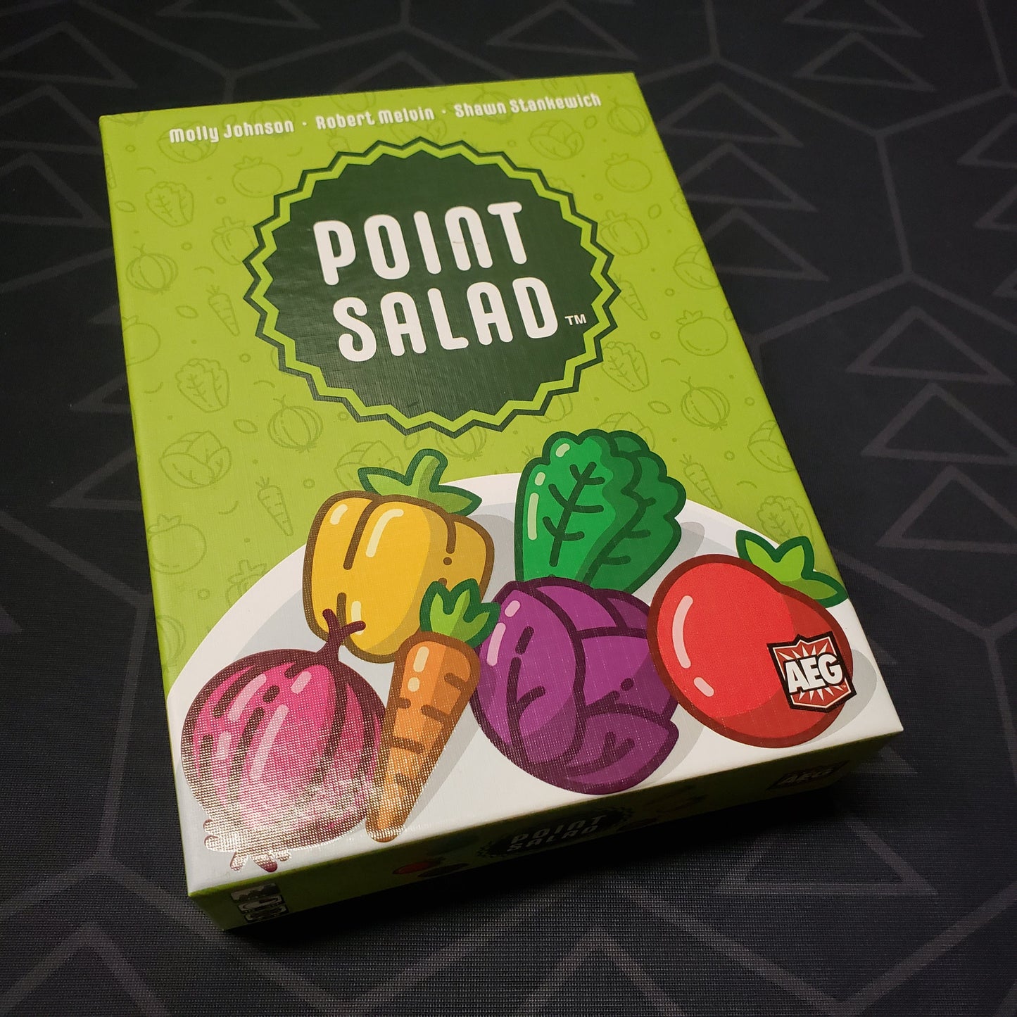 Image shows the front cover of the box for the Point Salad card game
