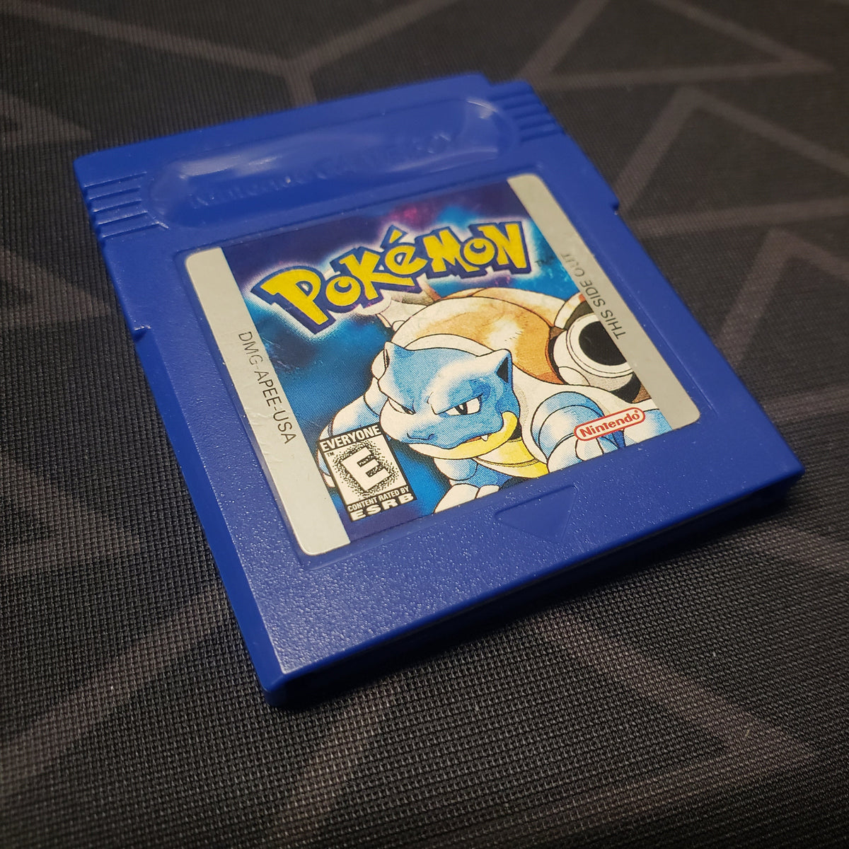 Image shows the outside of the cartridge for the game Pokemon Blue for Nintendo Game Boy