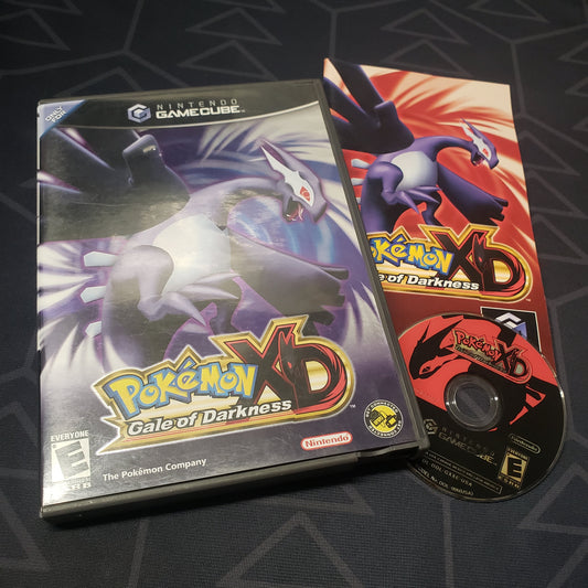 Image shows the case, manual and disc for the video game Pokemon XD: Gale of Darkness for Nintendo GameCube