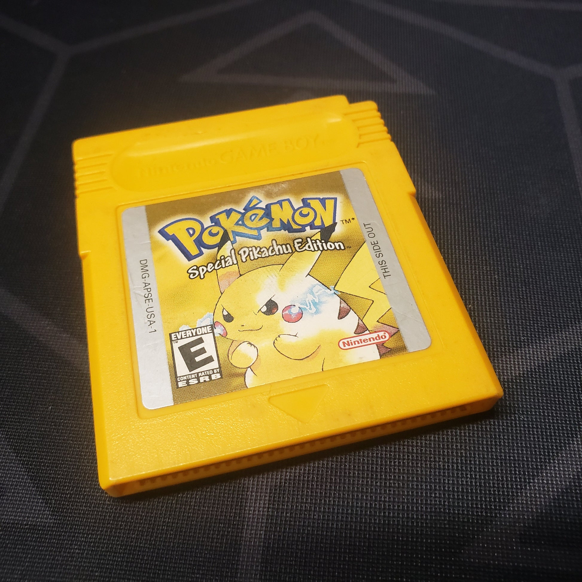 Image shows the front of the cartridge for the video game Pokemon Yellow for Nintendo Game Boy