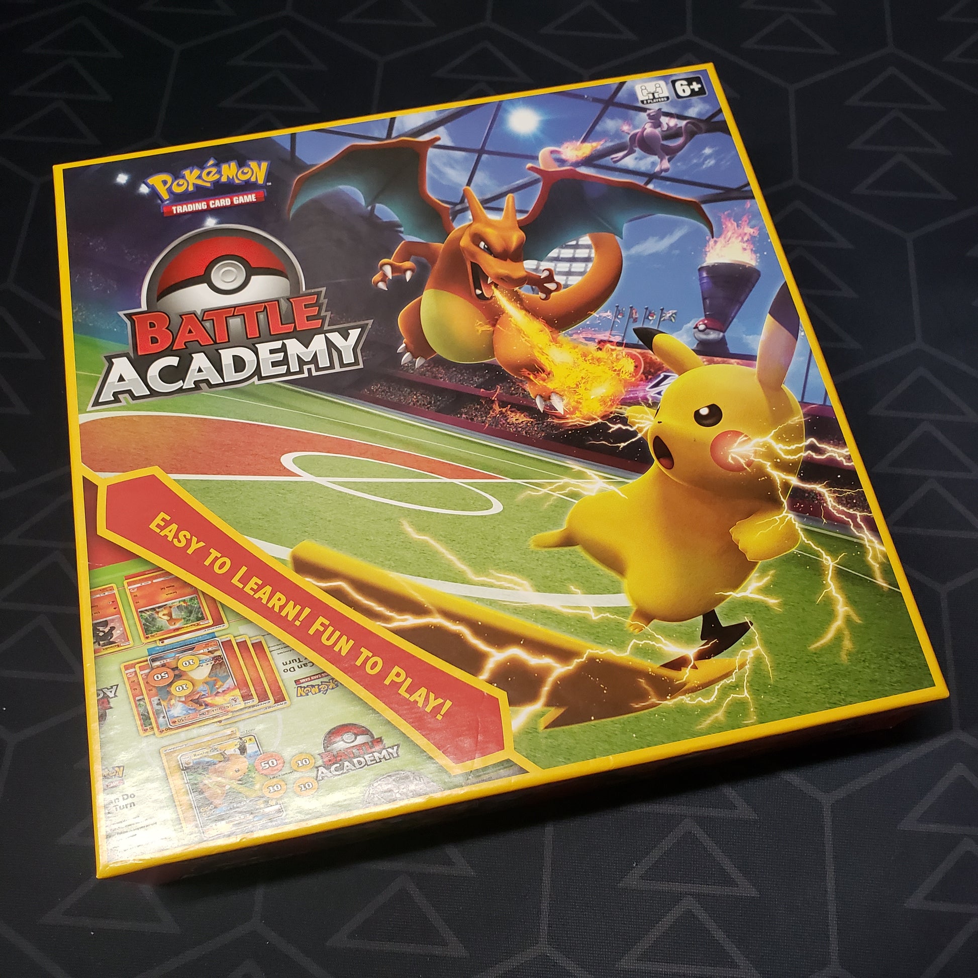 Image shows the front cover of the box of the 2020 Battle Academy set for the card game Pokemon