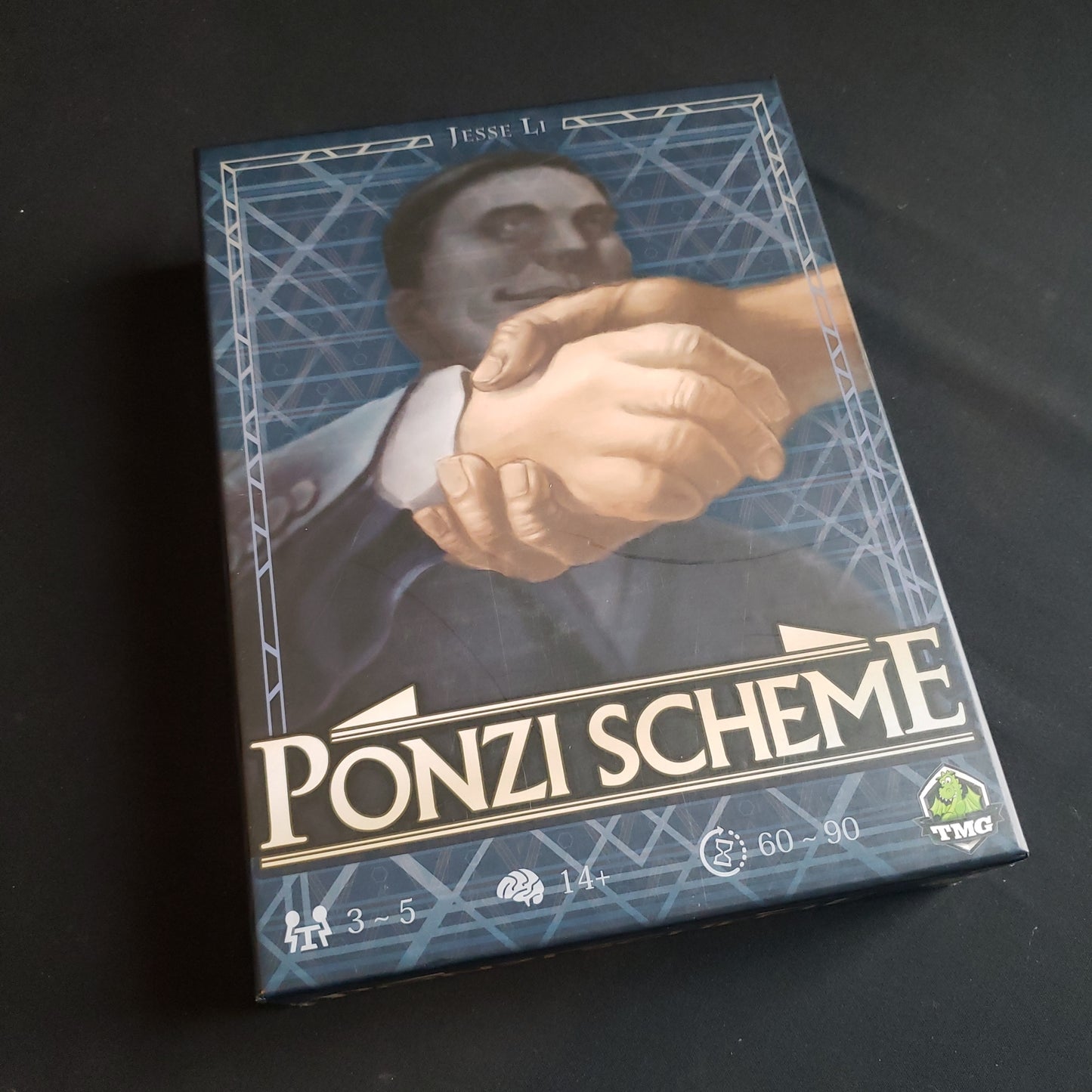 Image shows the front cover of the box of the Ponzi Scheme board game
