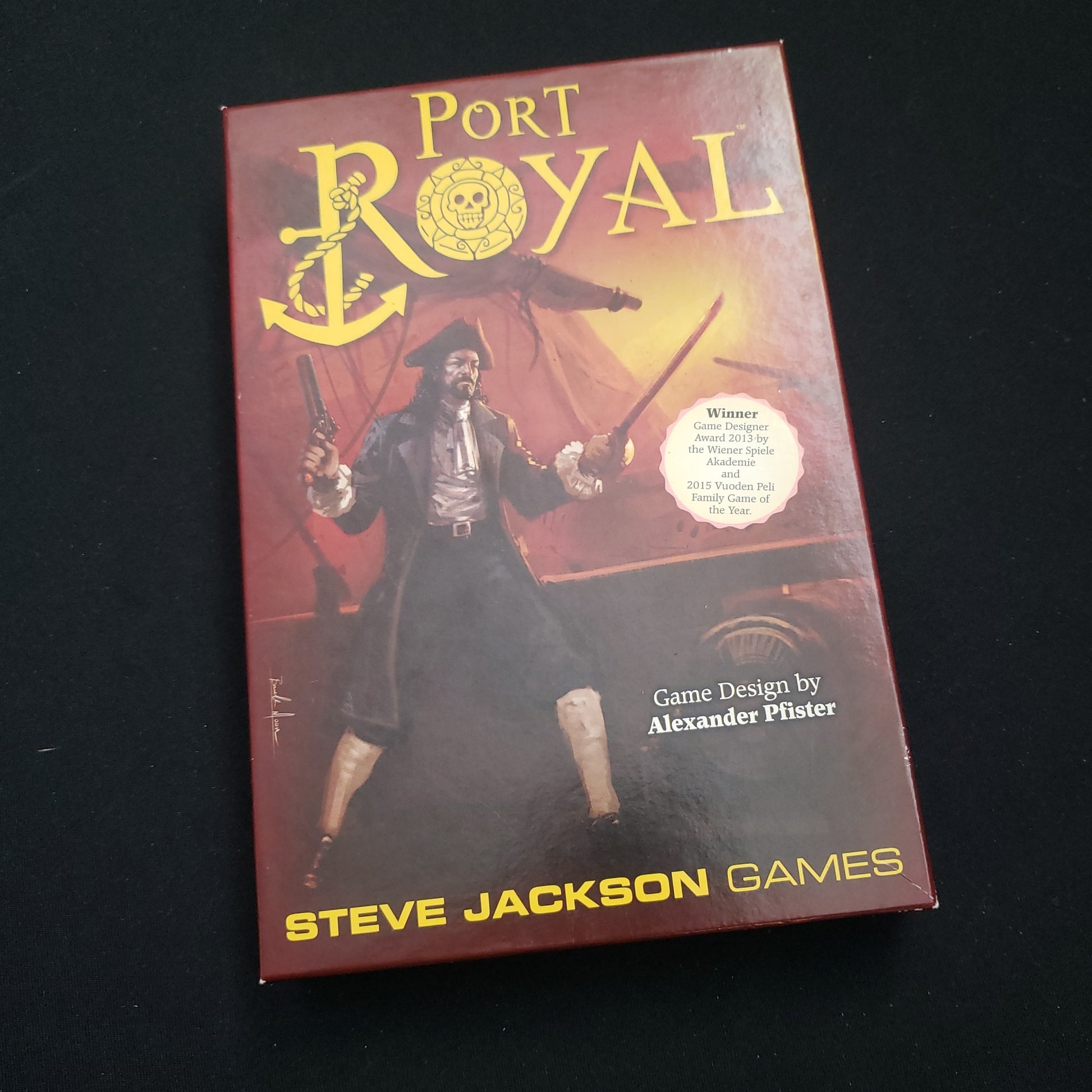 Image shows the front cover of the box of the Port Royal board game