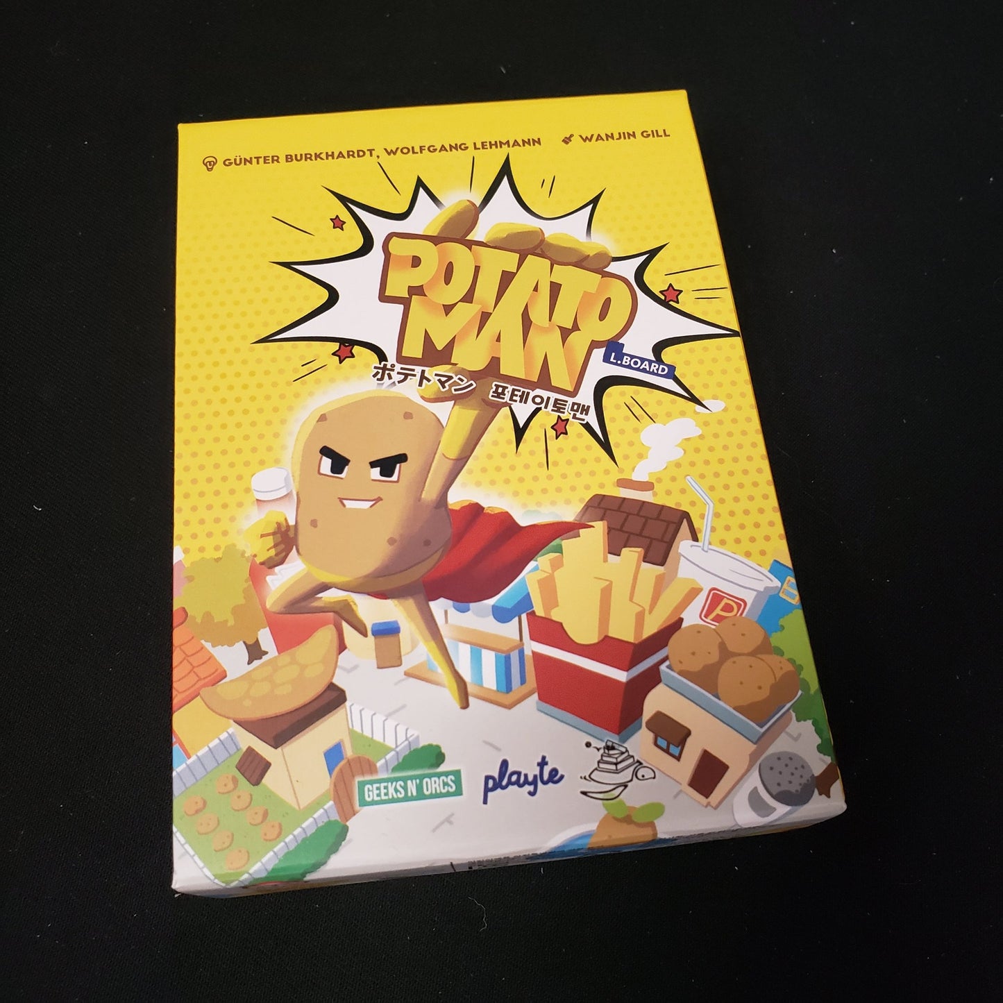 Image shows the front cover of the box of the Potato Man card game