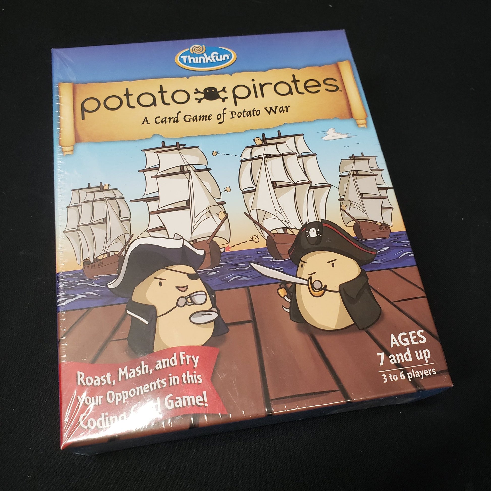 Image shows the front cover of the box of the Potato Pirates card game