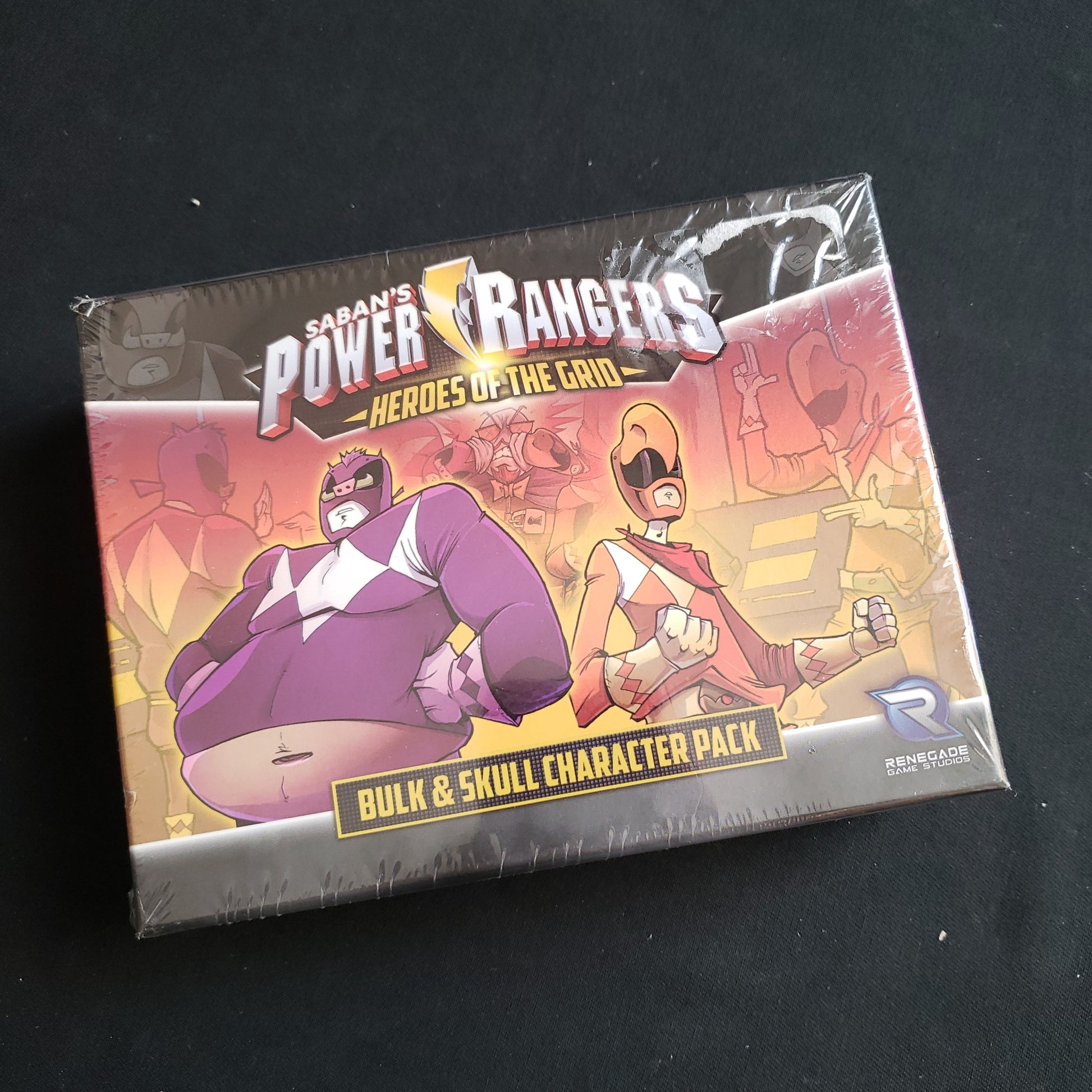 Image shows the front cover of the box of the Bulk & Skull Character Expansion for the board game Power Rangers: Heroes of the Grid