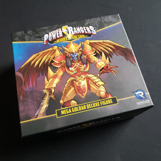 Image shows the front of the box for the Mega Golder Deluxe Figure Expansion for the Power Rangers: Heroes of the Grid board game