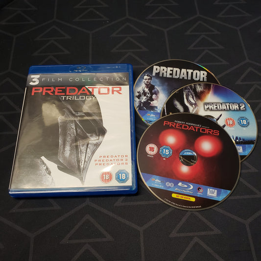 Image shows the case & three discs for the movie set of the Predator Trilogy on Blu-Ray