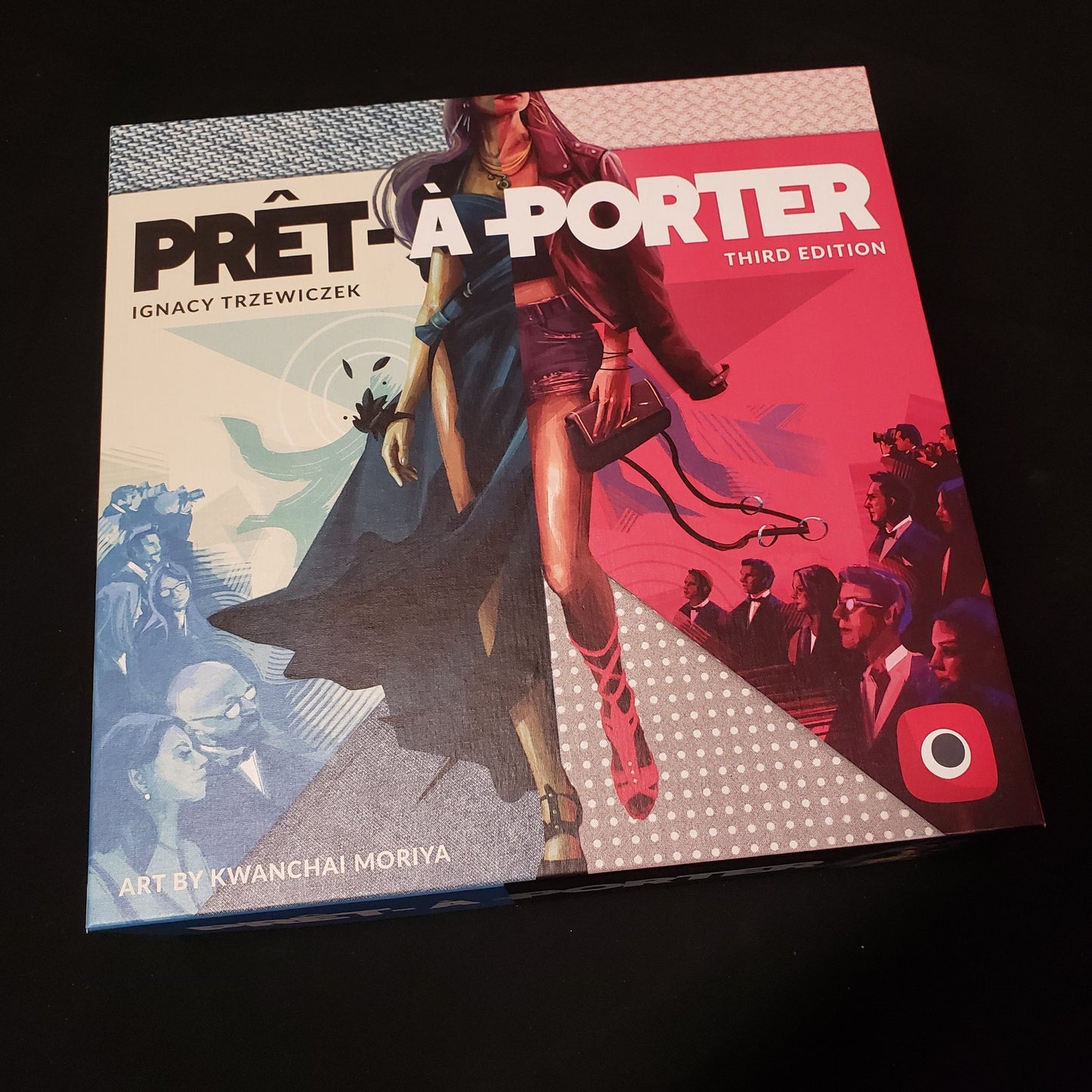 Image shows the front cover of the box of the Pret-A-Porter board game