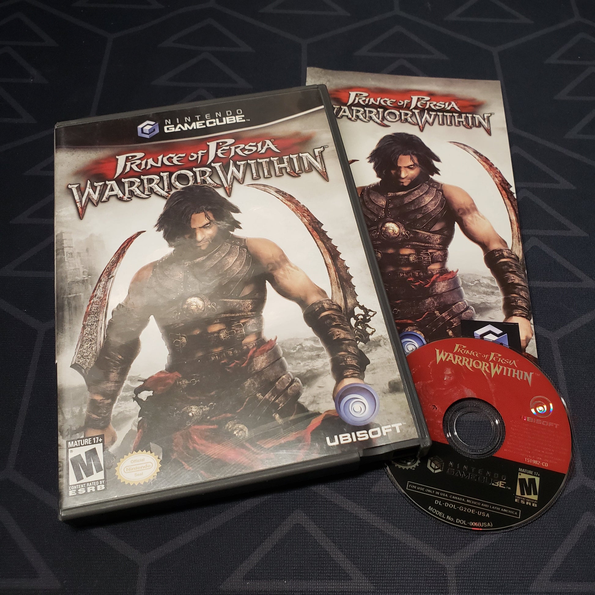 Image shows the case, manual and disc for the video game Prince of Persia: Warrior Within for Nintendo GameCube