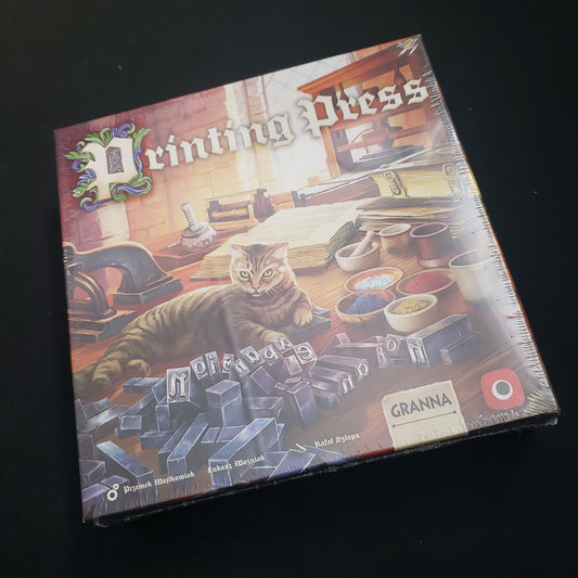 Image shows the front cover of the box of the Printing Press board game