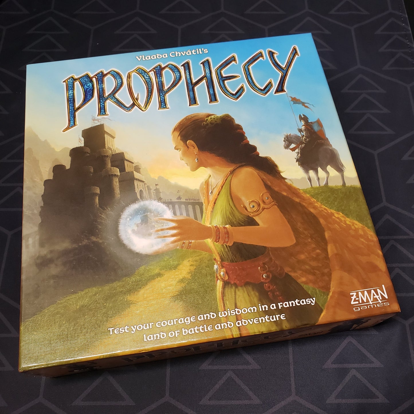 Image shows the front cover of the box of the Prophecy board game