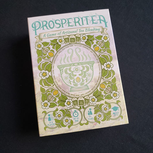 Image shows the front cover of the box of the Prosperitea card game