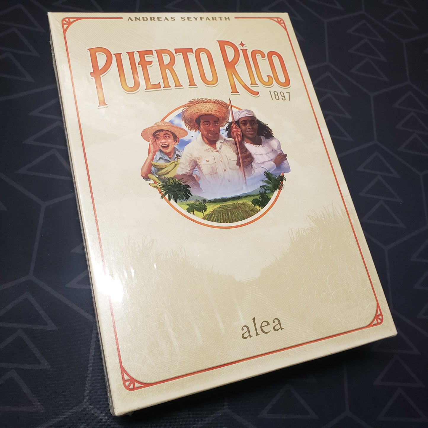 Image shows the front cover of the box of the Puerto Rico 1897 board game
