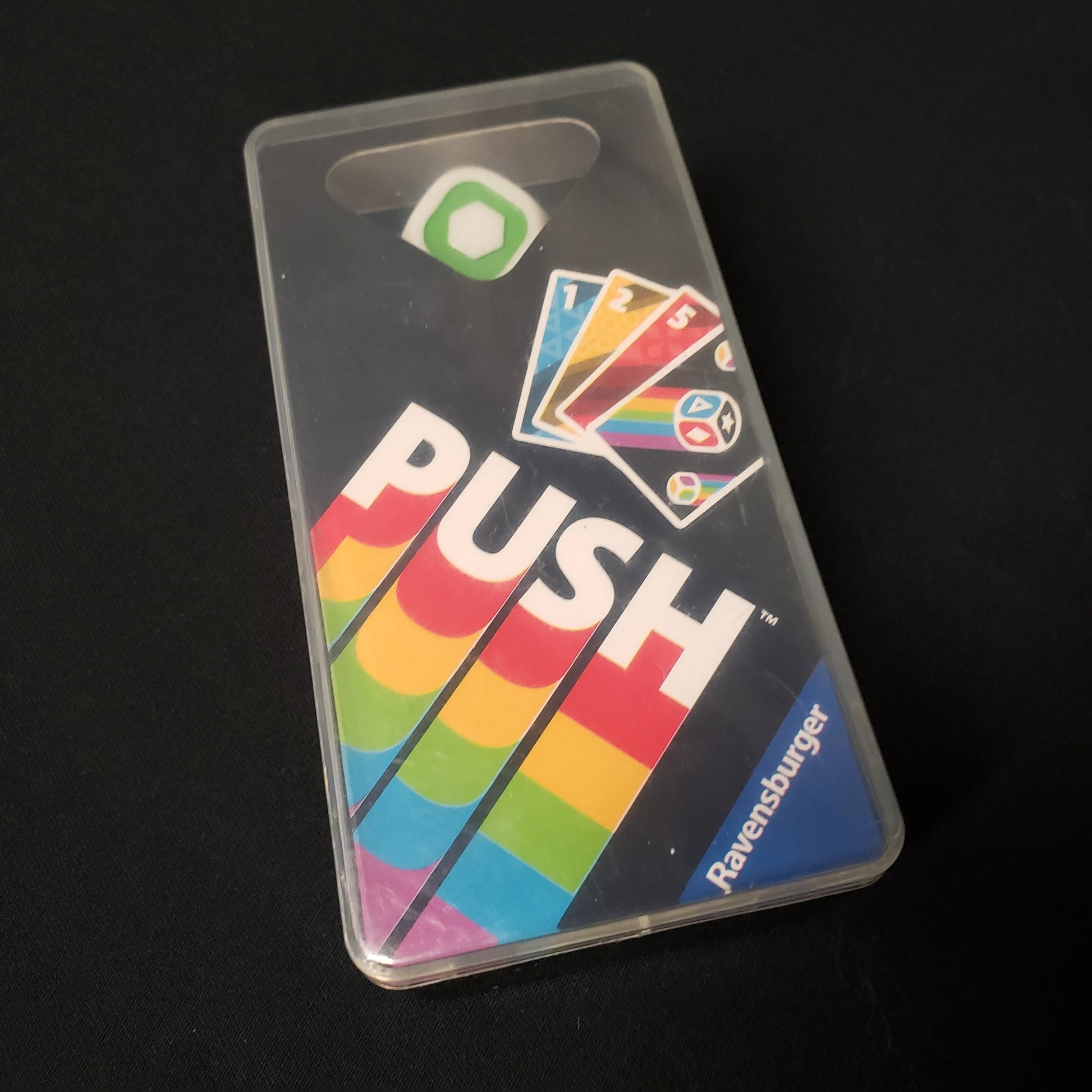 Image shows the front cover of the box of the PUSH card game