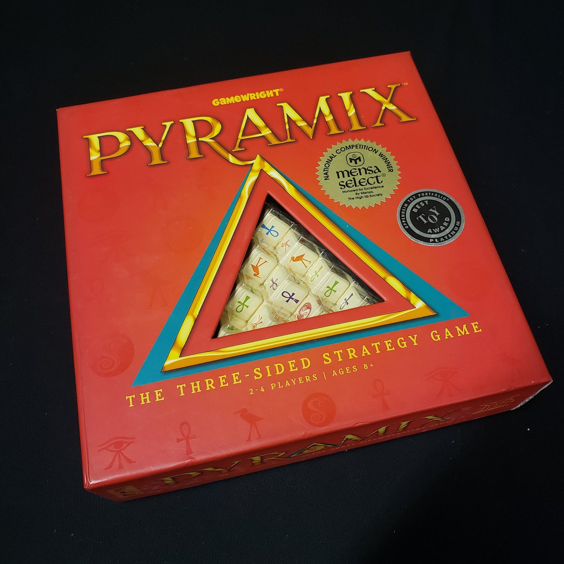 Image shows the front cover of the box of the Pyramix board game