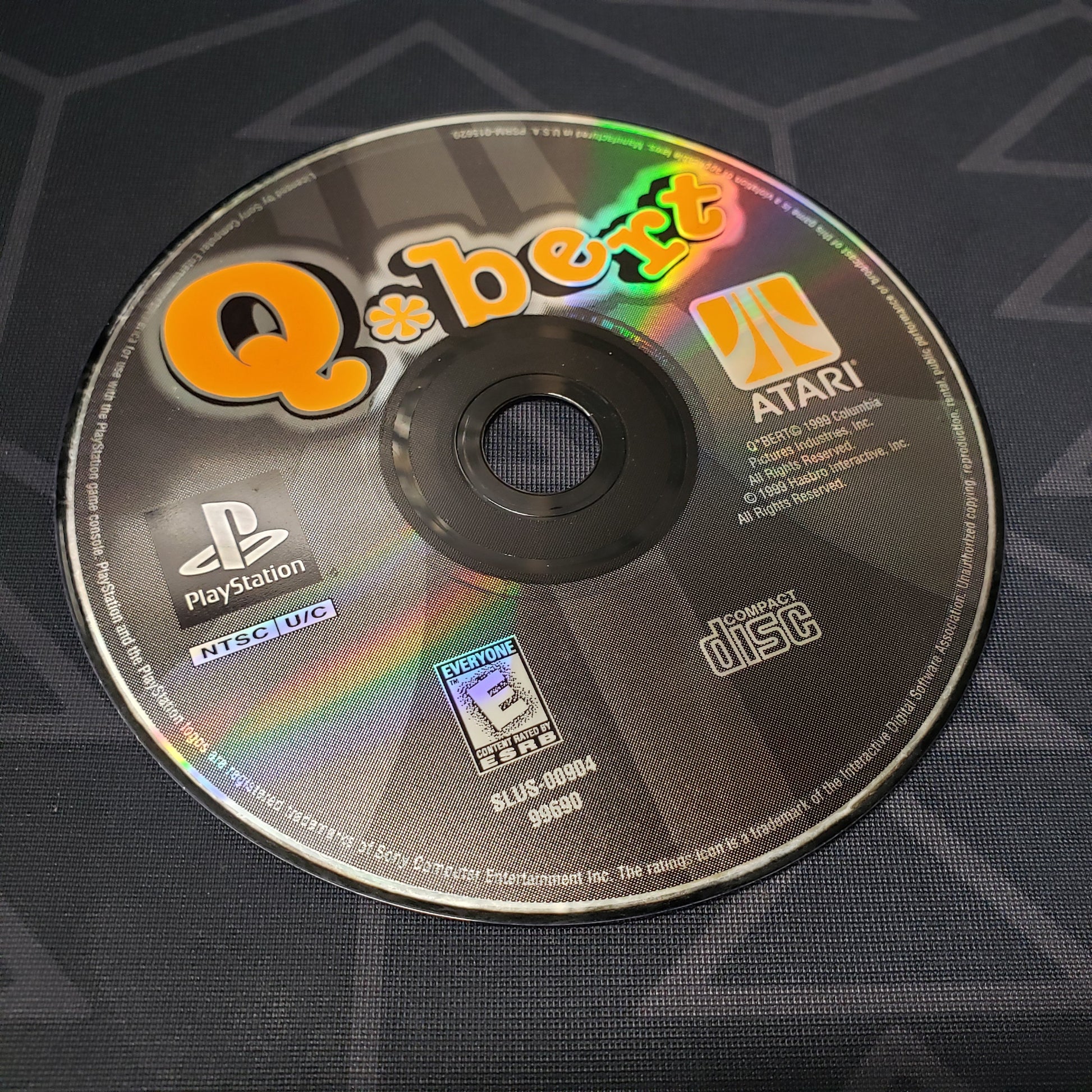 Image shows the label side of the game disc for the video game Q*Bert for Playstation 1
