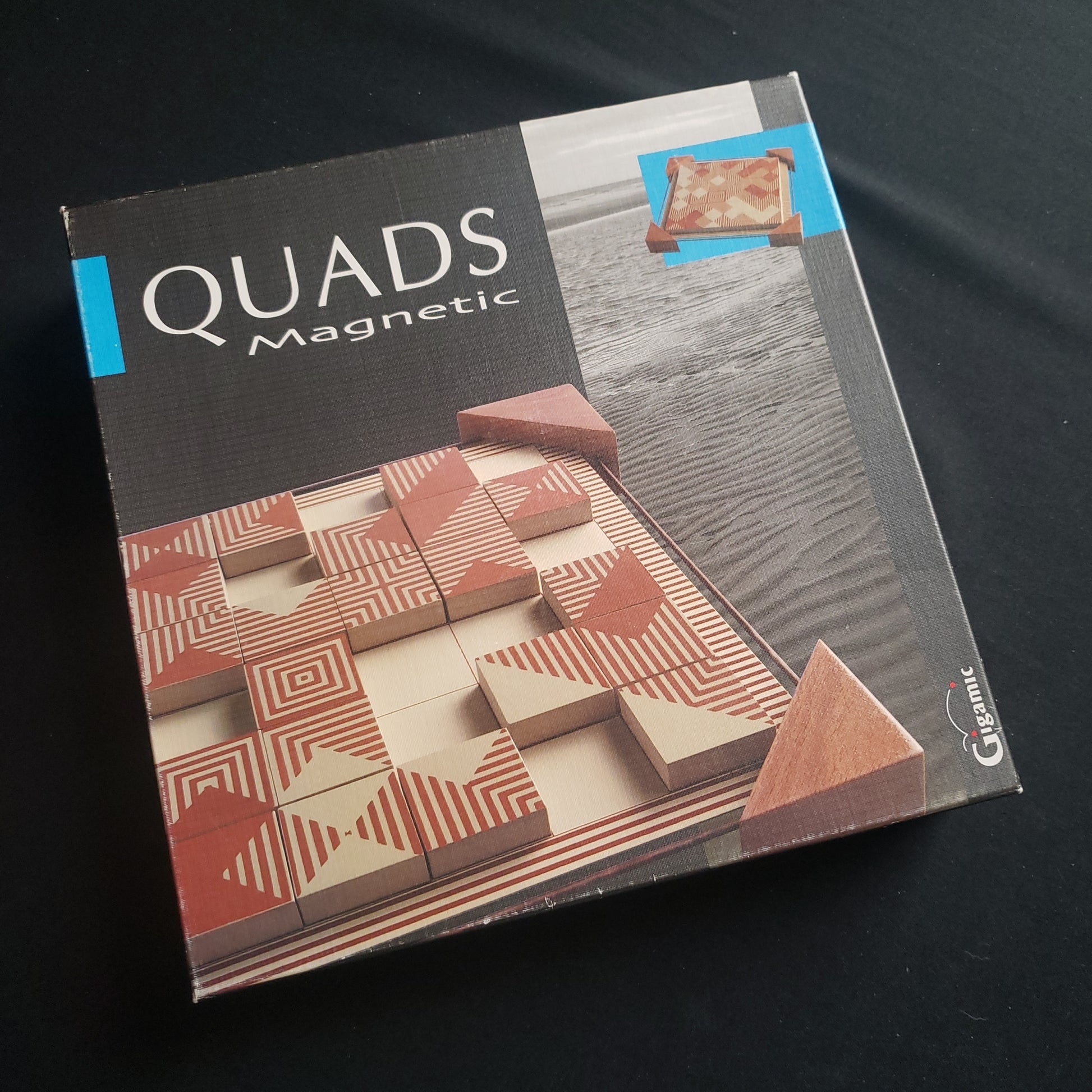 Image shows the front cover of the box of the Quads Magnetic board game