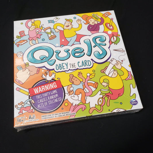 Image shows the front cover of the box of the Quelf party game