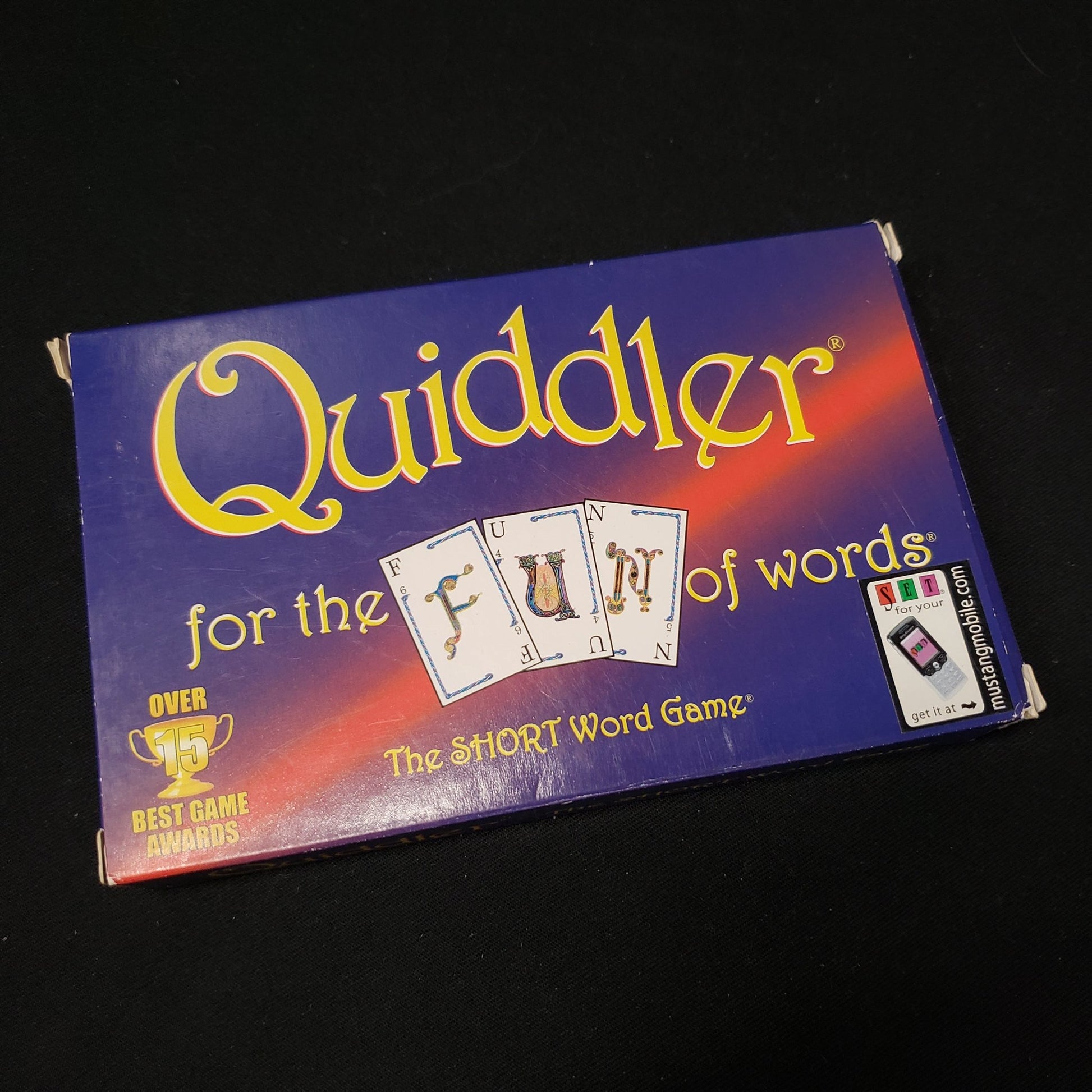 Image shows the front cover of the box of the Quiddler card game