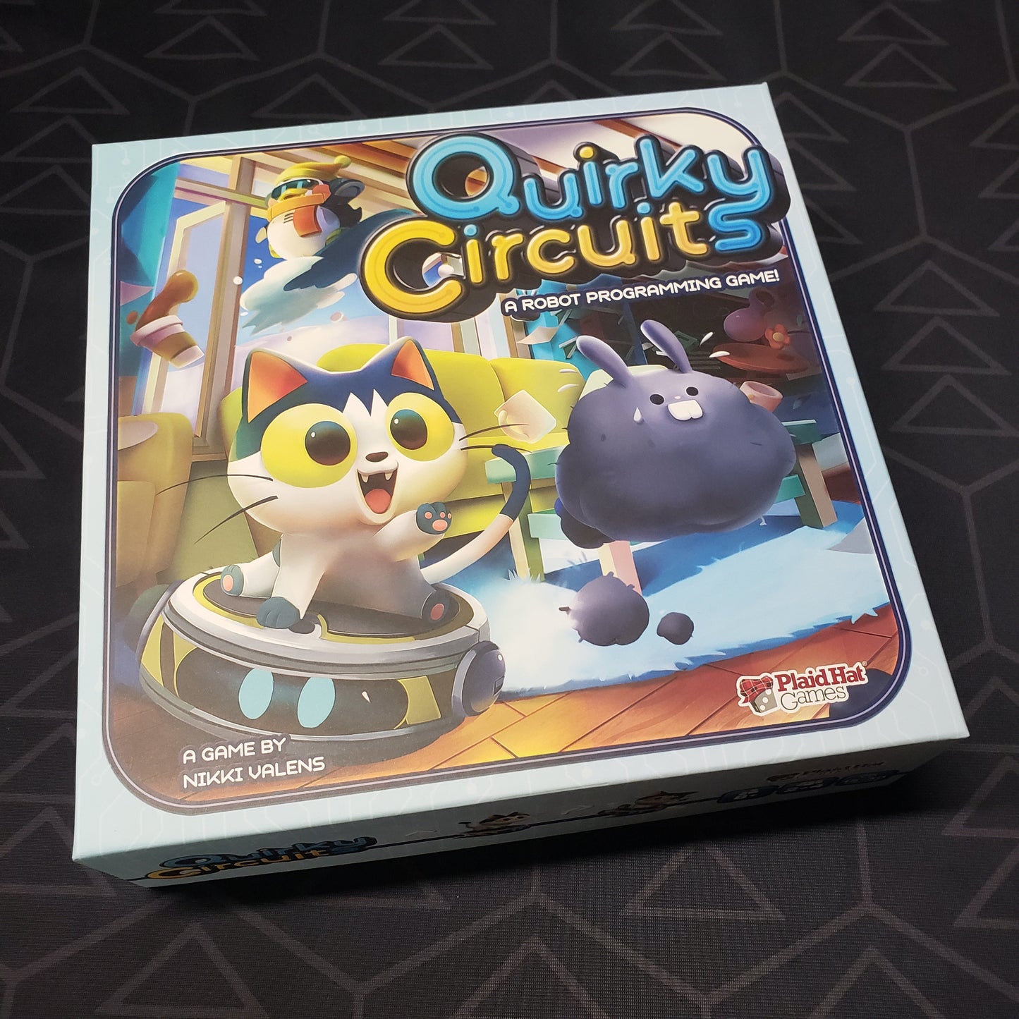 Image shows the front cover of the box of the Quirky Circuits board game