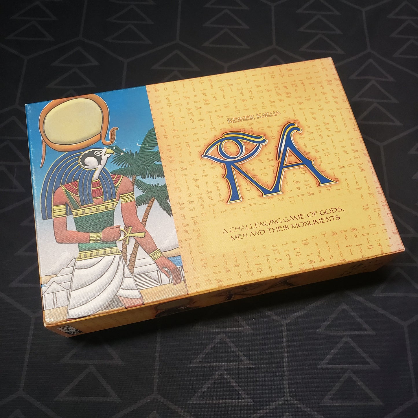 Image shows the front cover of the box for the 2005 Uberplay Printing of the board game RA