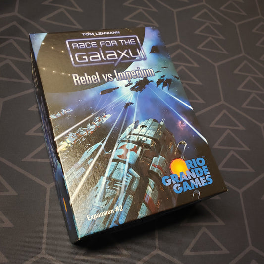 Image shows the front cover of the box of the Rebel vs Imperium expansion for the board game Race for the Galaxy