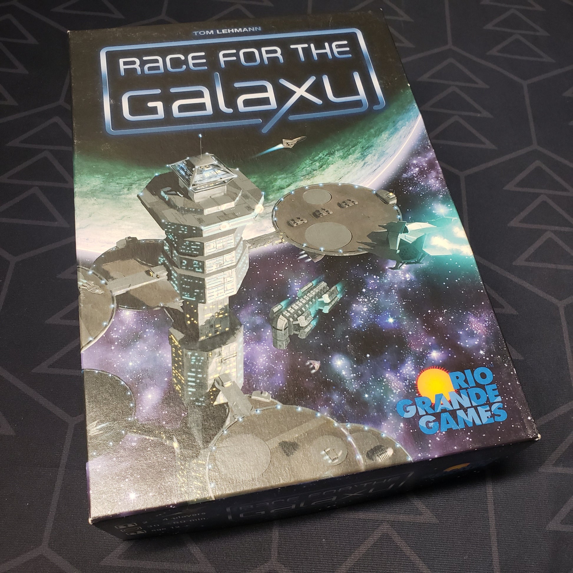 Image shows the front cover of the box for the Race for the Galaxy board game