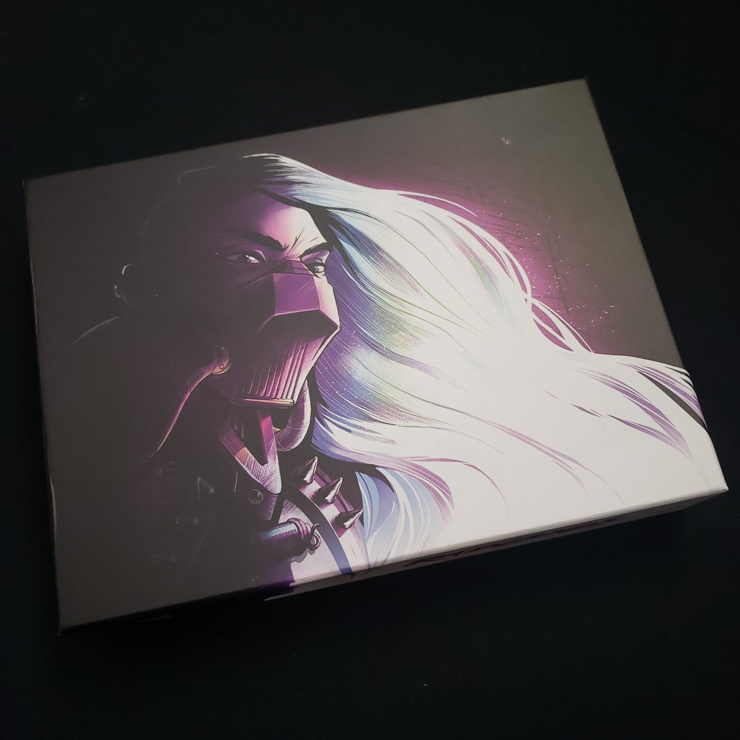 Image shows the front cover of the box of the Super Deluxe edition of the card game Radlands