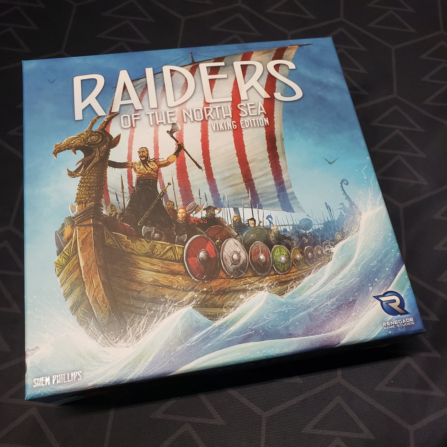 Image shows the front cover of the box for the Raiders of the North Sea: Viking Edition board game