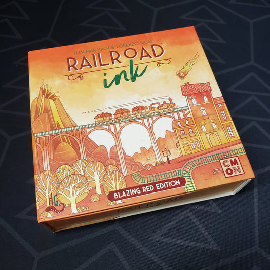 Image shows the front cover of the box of the board game Railroad Ink: Blazing Red Edition