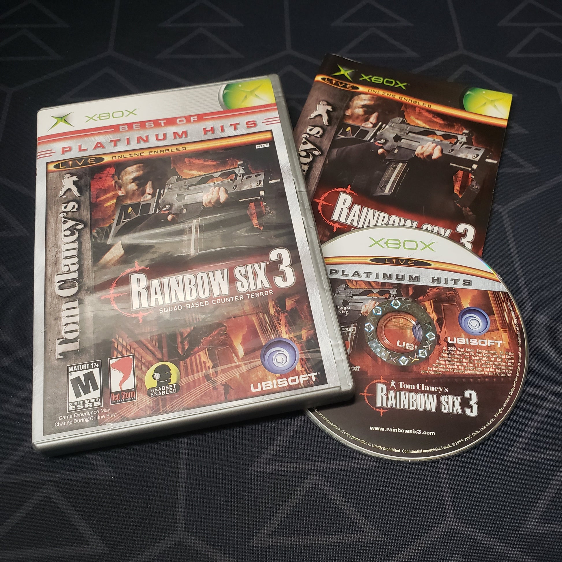Image shows the case, manual and disc for the video game Rainbow Six 3 for the original Xbox