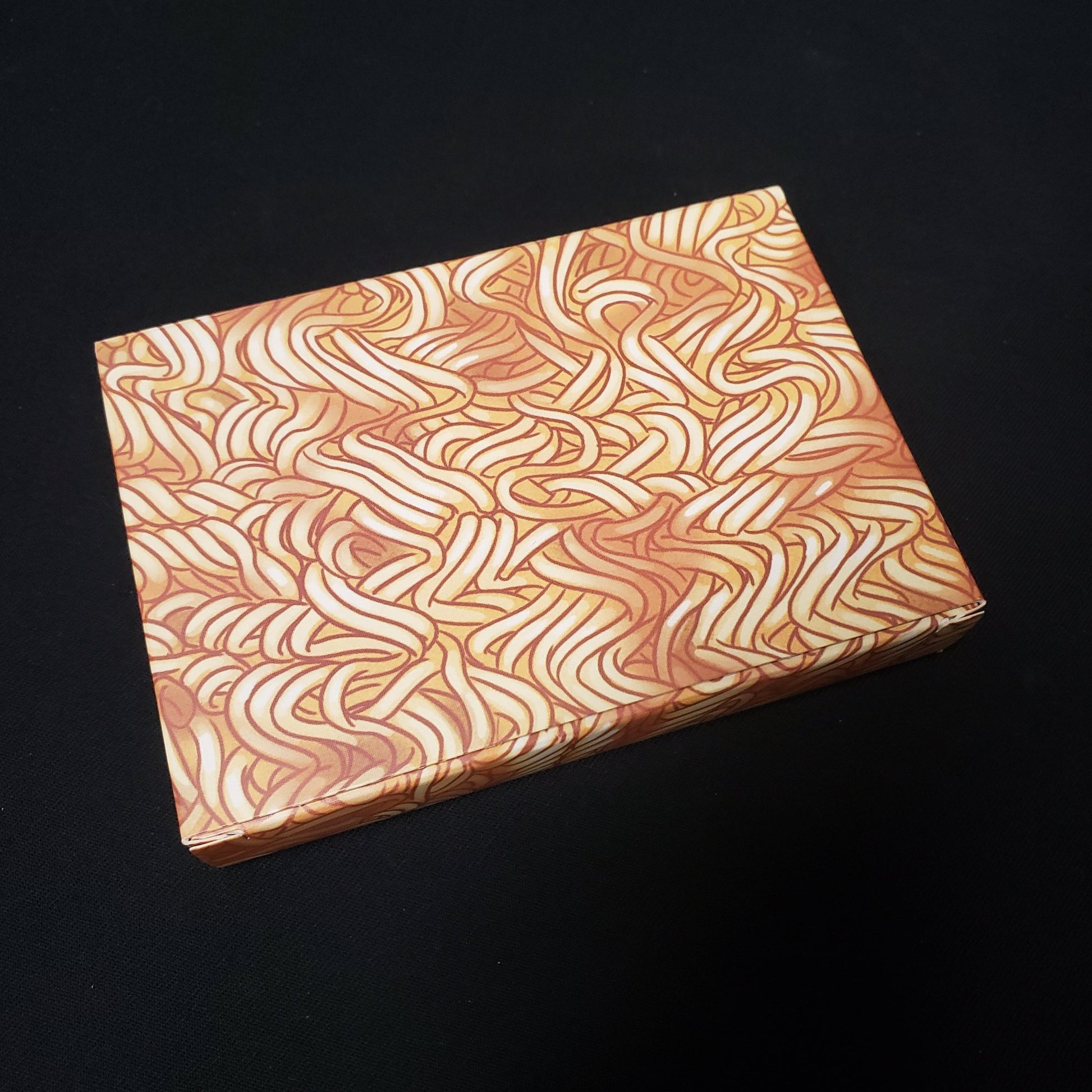 Image shows the inner box of the package of the Ramen Fury card game