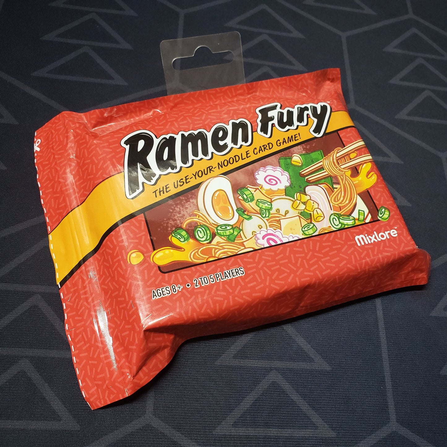 Image shows the front of the packaging of the Ramen Fury card game