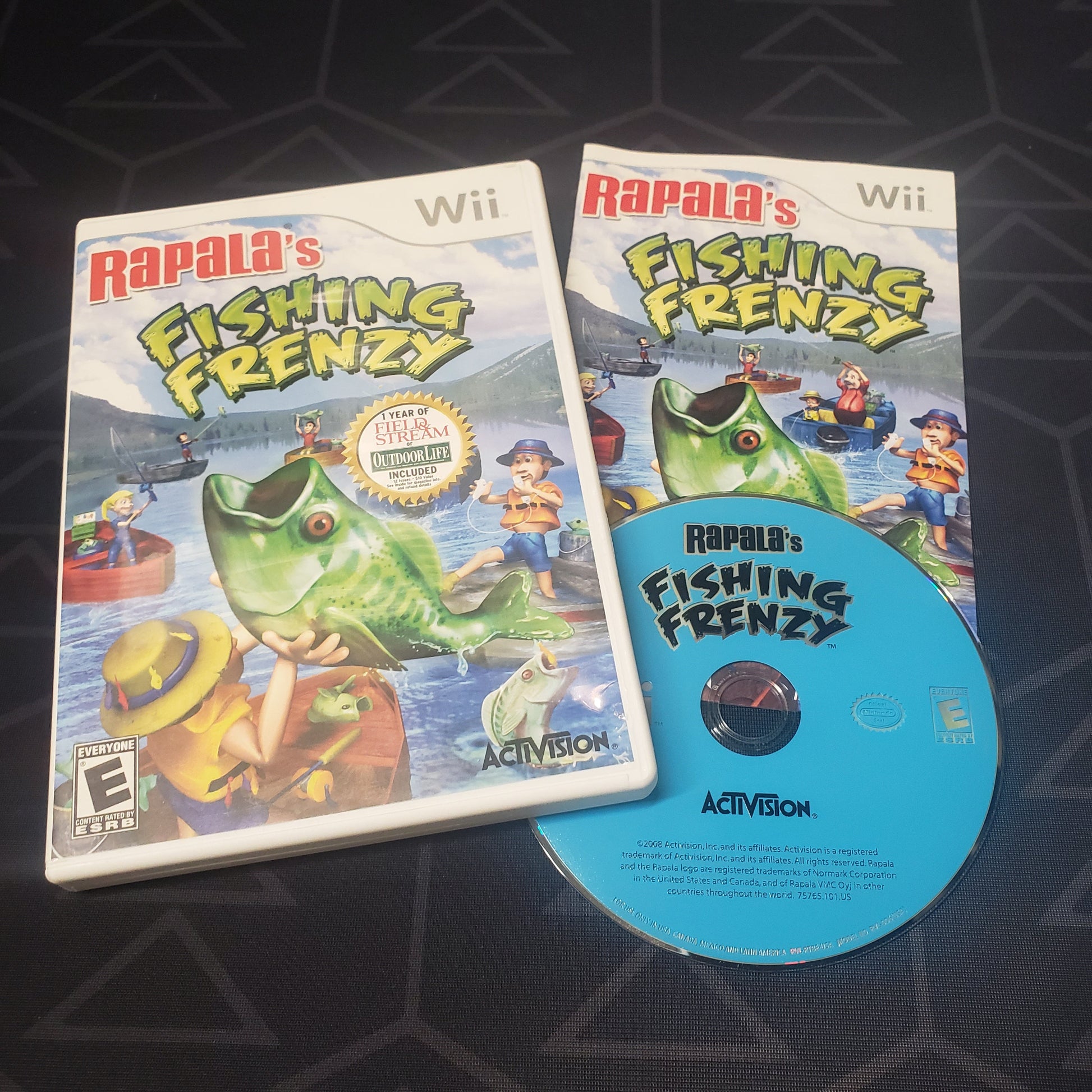 Image shows the case, manual & disc for the video gameRapala's Fishing Frenzy for Nintendo Wii