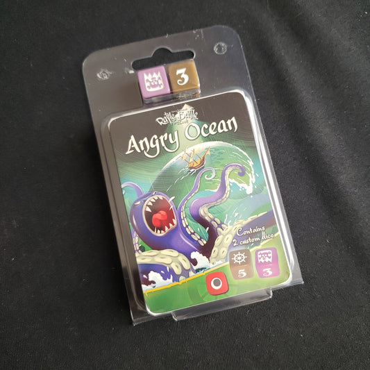 Image shows the front cover of the package of the Angry Ocean expansion for the board game Rattle, Battle, Grab the Loot