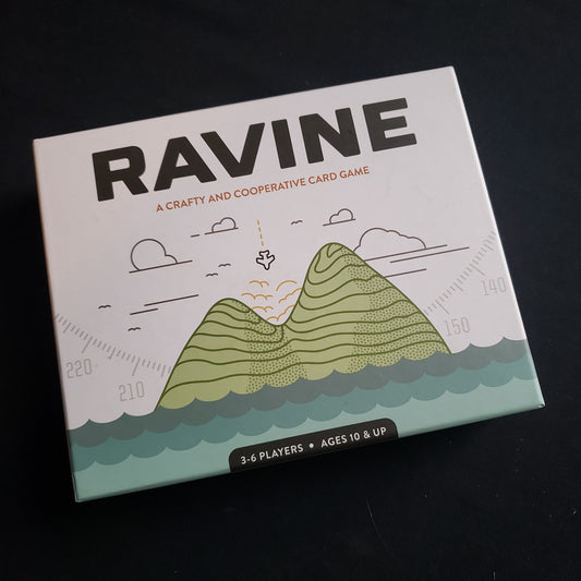 Image shows the front cover of the box of the Ravine card game