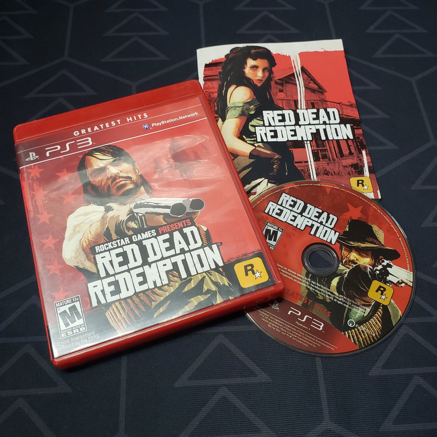 Image shows the case, manual and disc for the video game Red Dead Redemption for Playstation 3