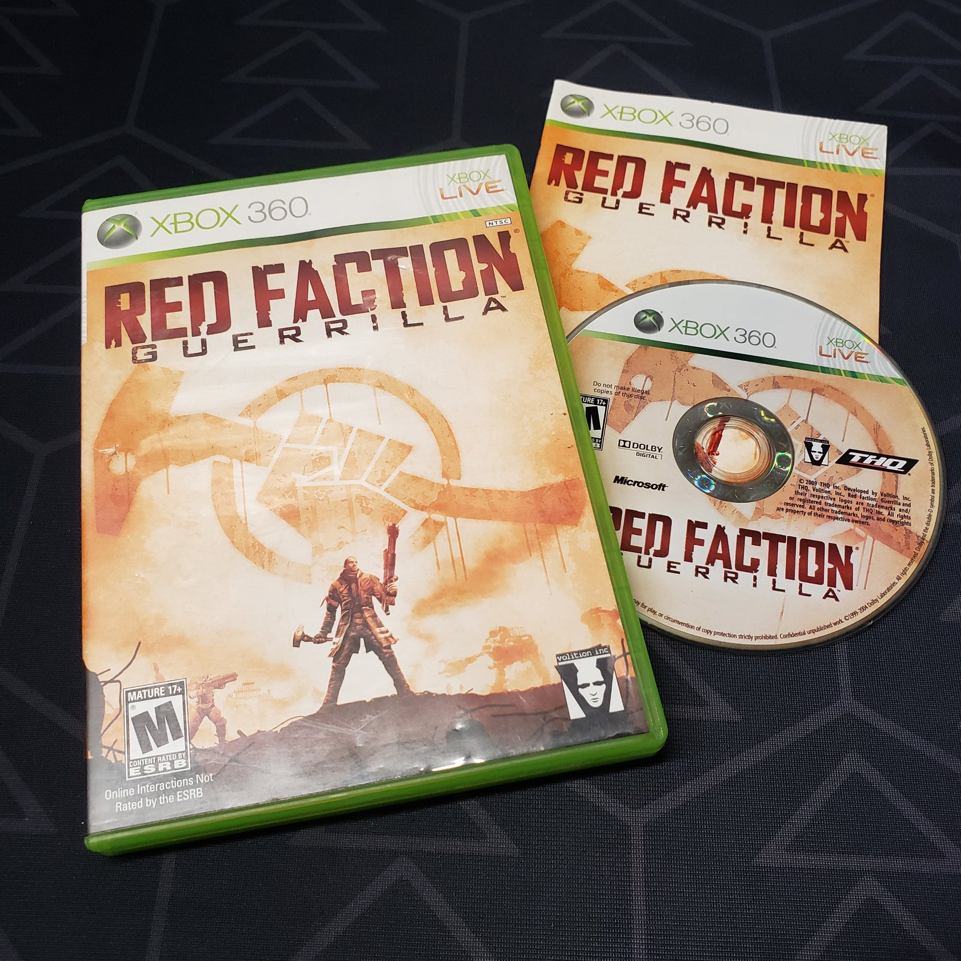 Image shows the case, manual and disc for the video game Red Faction: Guerrilla for Xbox 360