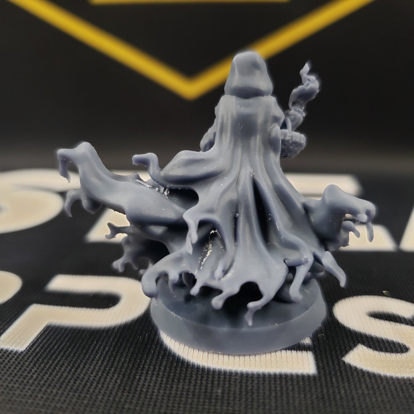Image shows the back of a vampire fighter gaming miniature.