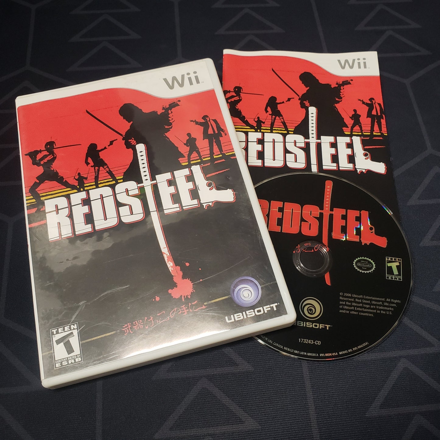 Image shows the case, manual & disc for the video game Red Steel for Nintendo Wii