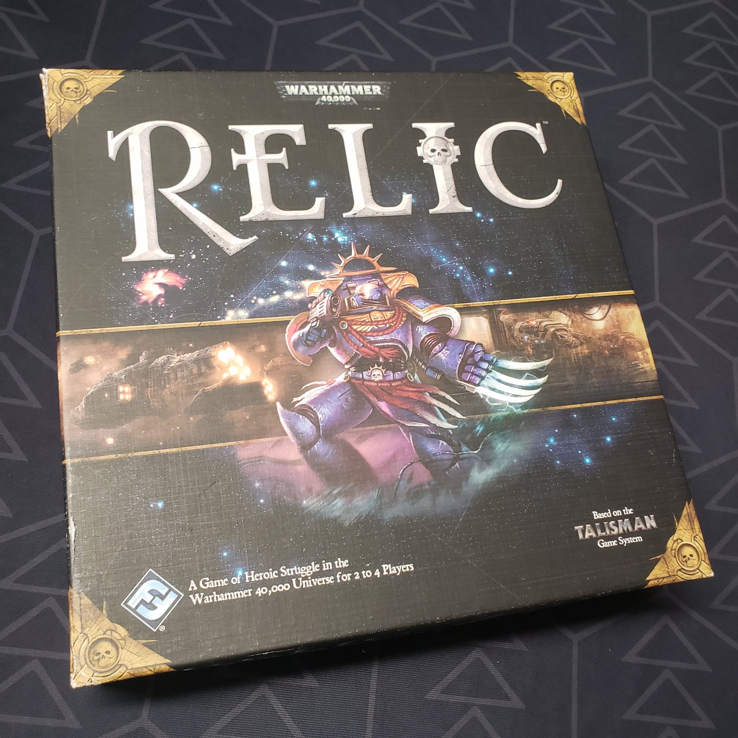 Image shows the front cover of the box of the Relic board game