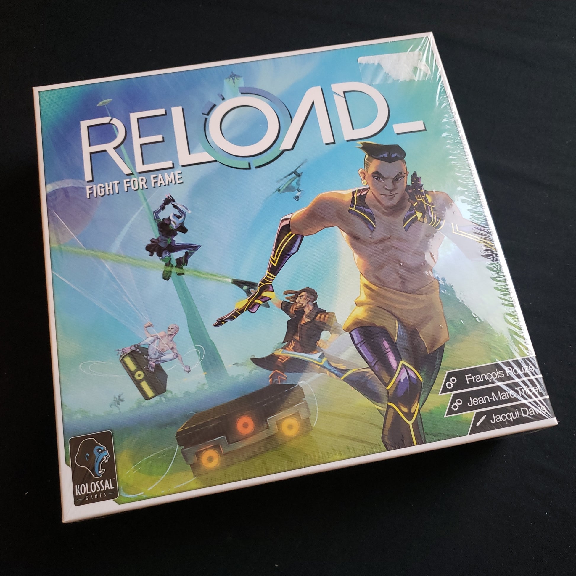 Image shows the front cover of the box of the Reload board game